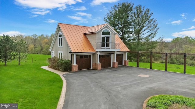 1402 Thurston Rd, Dickerson, MD 20842 - view of front of property featuring a standing seam roof, a balcony, asphalt driveway, a front yard, and a garage