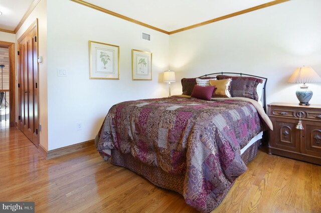 1402 Thurston Rd, Dickerson, MD 20842 - bedroom featuring crown molding, wood finished floors, and baseboards