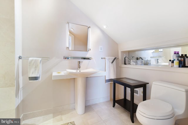 1402 Thurston Rd, Dickerson, MD 20842 - bathroom featuring lofted ceiling, toilet, tile patterned floors, and baseboards