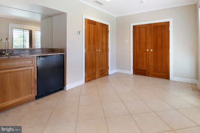 1402 Thurston Rd, Dickerson, MD 20842 - kitchen with refrigerator, a sink, baseboards, and ornamental molding