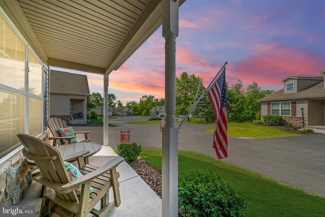 43 Ivy Ln, Gettysburg, PA 17325 - patio terrace at dusk featuring a yard and covered porch