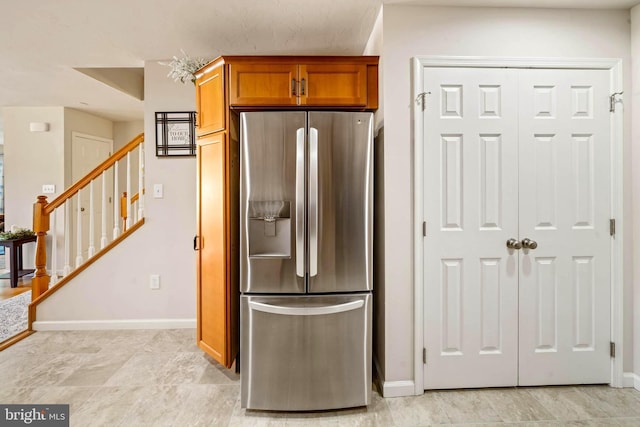 43 Ivy Ln, Gettysburg, PA 17325 - kitchen with stainless steel refrigerator with ice dispenser, baseboards, and brown cabinetry