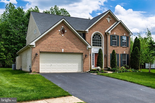 460 Preakness Run, Newark, DE 19702 - view of front of home featuring driveway, central AC, a garage, and a front lawn