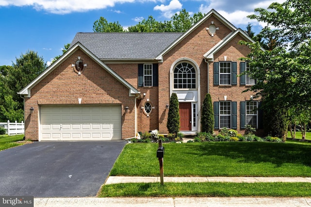 460 Preakness Run, Newark, DE 19702 - view of front of home featuring asphalt driveway, a front lawn, an attached garage, and brick siding