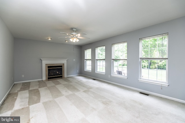 460 Preakness Run, Newark, DE 19702 - unfurnished living room featuring a ceiling fan, light colored carpet, baseboards, and a fireplace with flush hearth