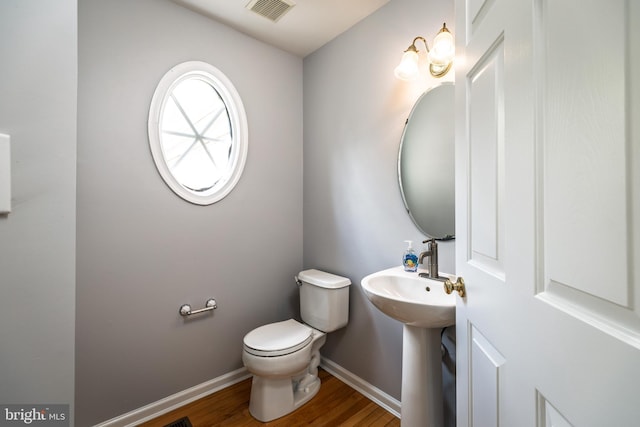 460 Preakness Run, Newark, DE 19702 - half bathroom with baseboards, toilet, wood finished floors, and a sink