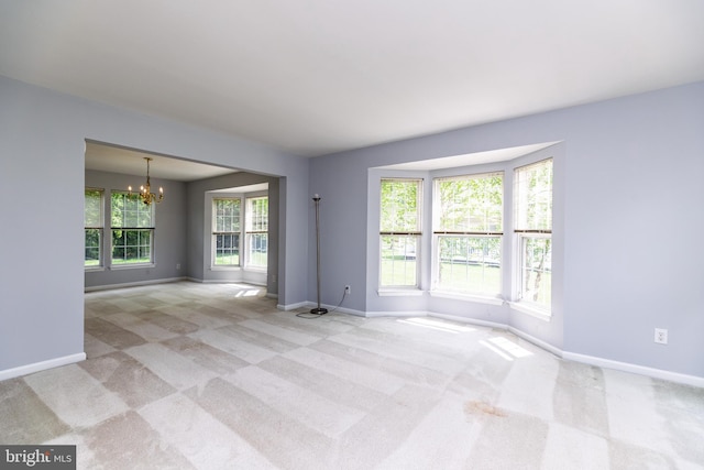 460 Preakness Run, Newark, DE 19702 - carpeted spare room featuring a chandelier and baseboards