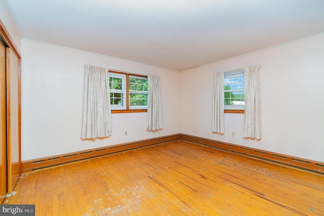 148 N Good Spring Rd, Hegins, PA 17938 - unfurnished room with hardwood / wood-style flooring, crown molding, and a baseboard radiator
