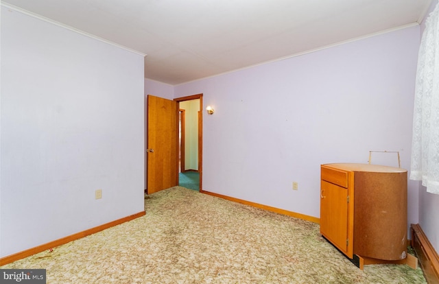148 N Good Spring Rd, Hegins, PA 17938 - spare room featuring ornamental molding, baseboards, and light carpet
