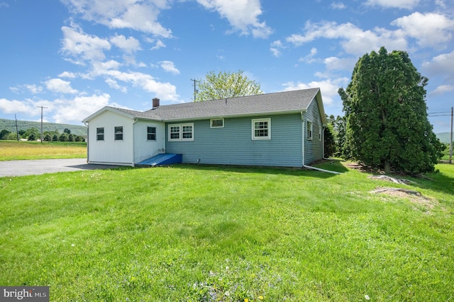 148 N Good Spring Rd, Hegins, PA 17938 - back of house with a lawn and a chimney