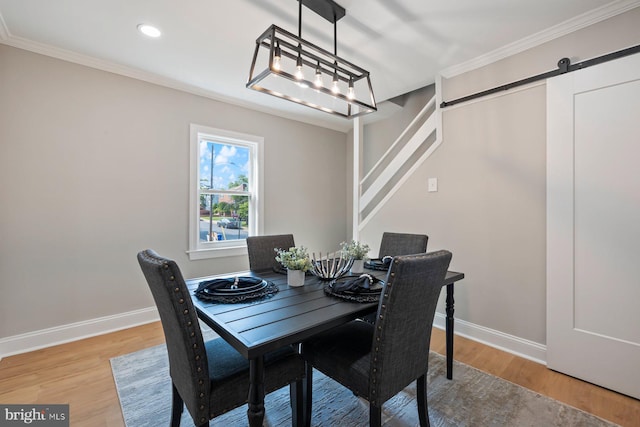 4914 22nd St N, Arlington, VA 22207 - dining space featuring ornamental molding, light wood-style flooring, a barn door, baseboards, and recessed lighting