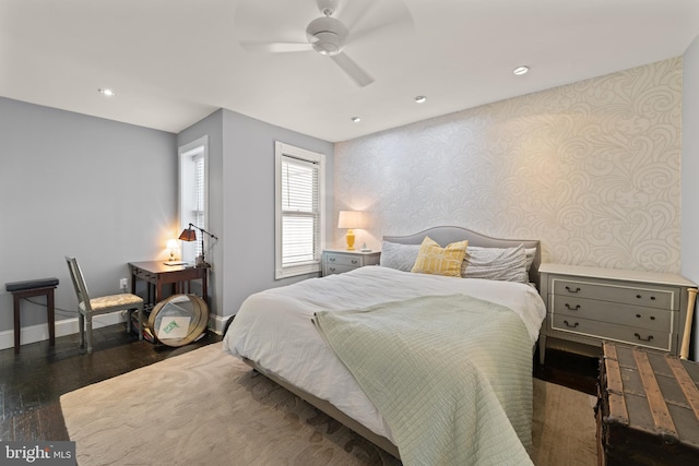 bedroom with wallpapered walls, baseboards, wood finished floors, recessed lighting, and ceiling fan