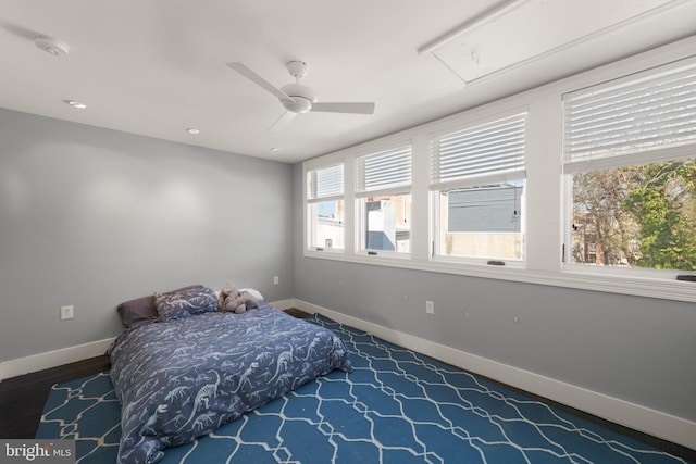 bedroom with multiple windows, baseboards, ceiling fan, and recessed lighting