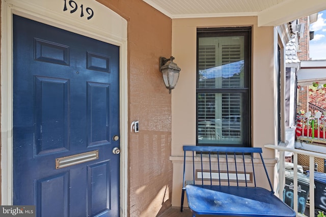 property entrance with covered porch