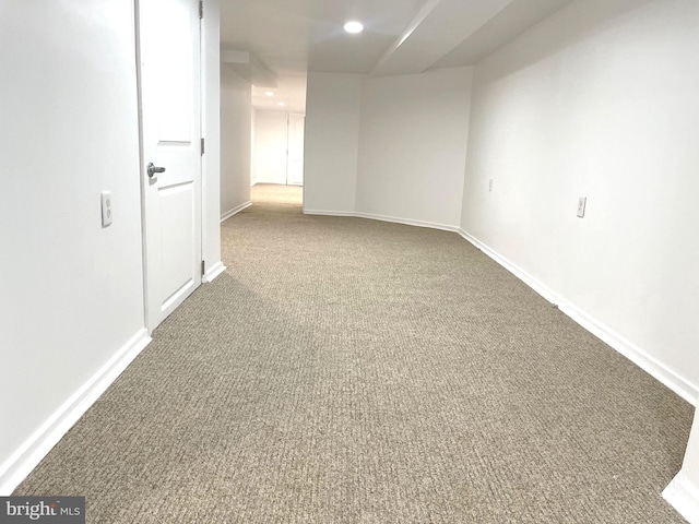 carpeted empty room with baseboards and recessed lighting