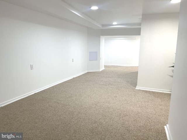 carpeted spare room featuring recessed lighting and baseboards