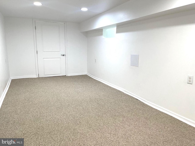 finished basement featuring carpet flooring, recessed lighting, and baseboards