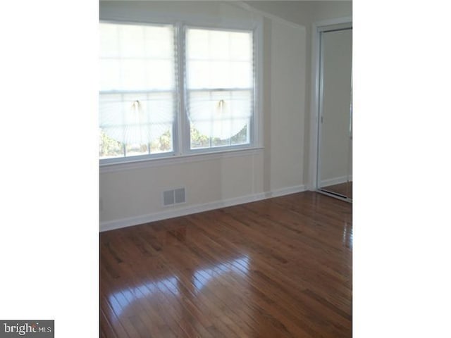 810 Hughes Dr, Hamilton, NJ 08690 - unfurnished room featuring dark wood-type flooring and baseboards
