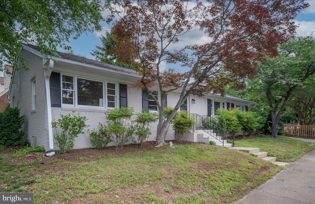 view of front of house featuring brick siding
