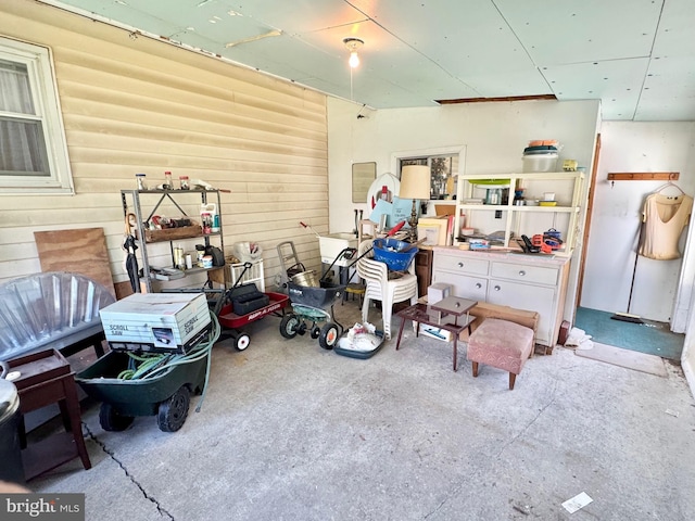 garage featuring wood walls