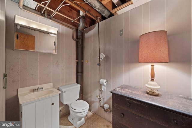 bathroom featuring toilet and vanity