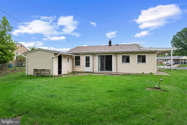 rear view of property featuring a chimney