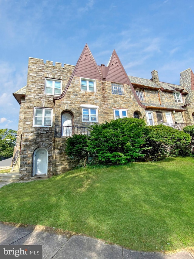 1800 N 52nd St, Philadelphia, PA 19131 - tudor house featuring stone siding and a front lawn