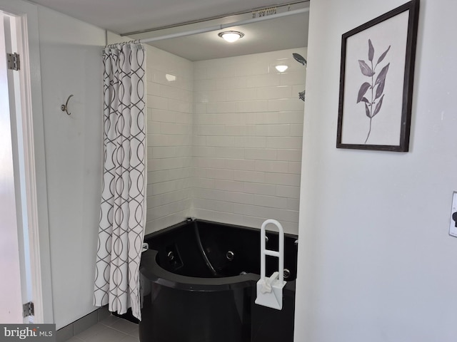 bathroom with tile patterned floors and a combined bath / shower with jetted tub