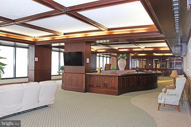 reception featuring coffered ceiling, ornamental molding, and beam ceiling
