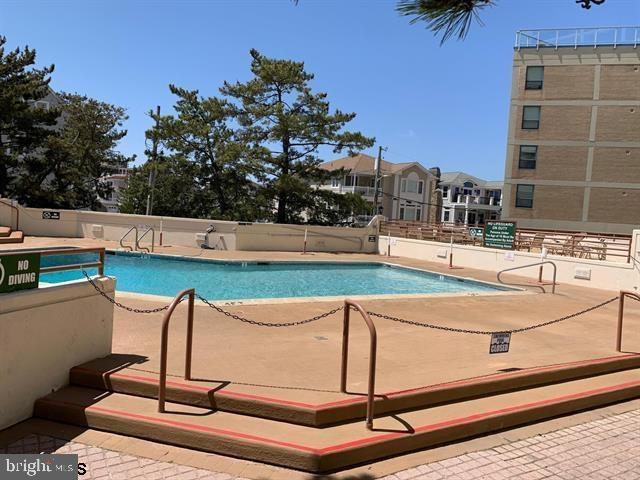 community pool with a patio