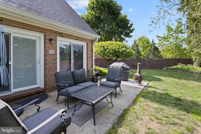 view of patio featuring an outdoor living space and grilling area