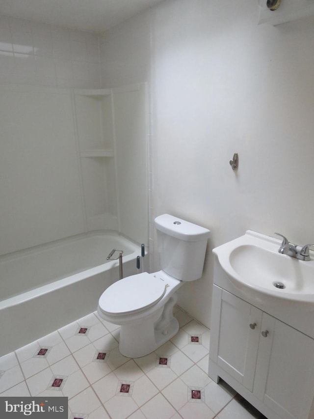 full bath featuring toilet, vanity, bathtub / shower combination, and tile patterned flooring
