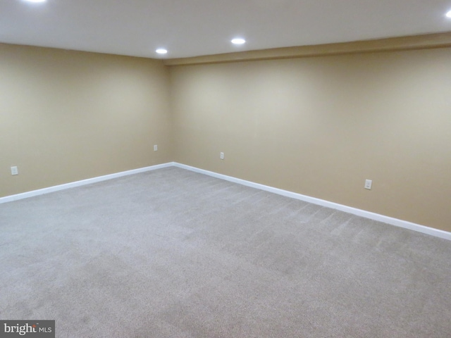 finished below grade area featuring recessed lighting, baseboards, and carpet