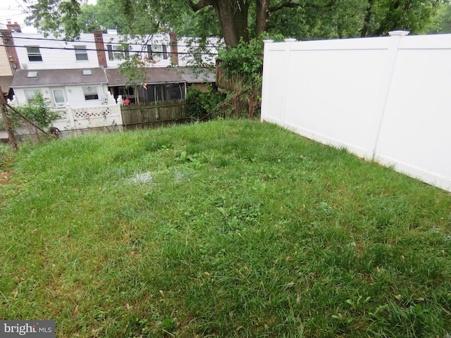 view of yard with fence