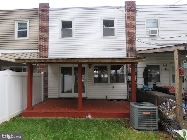 back of house featuring central air condition unit, fence, and a wooden deck
