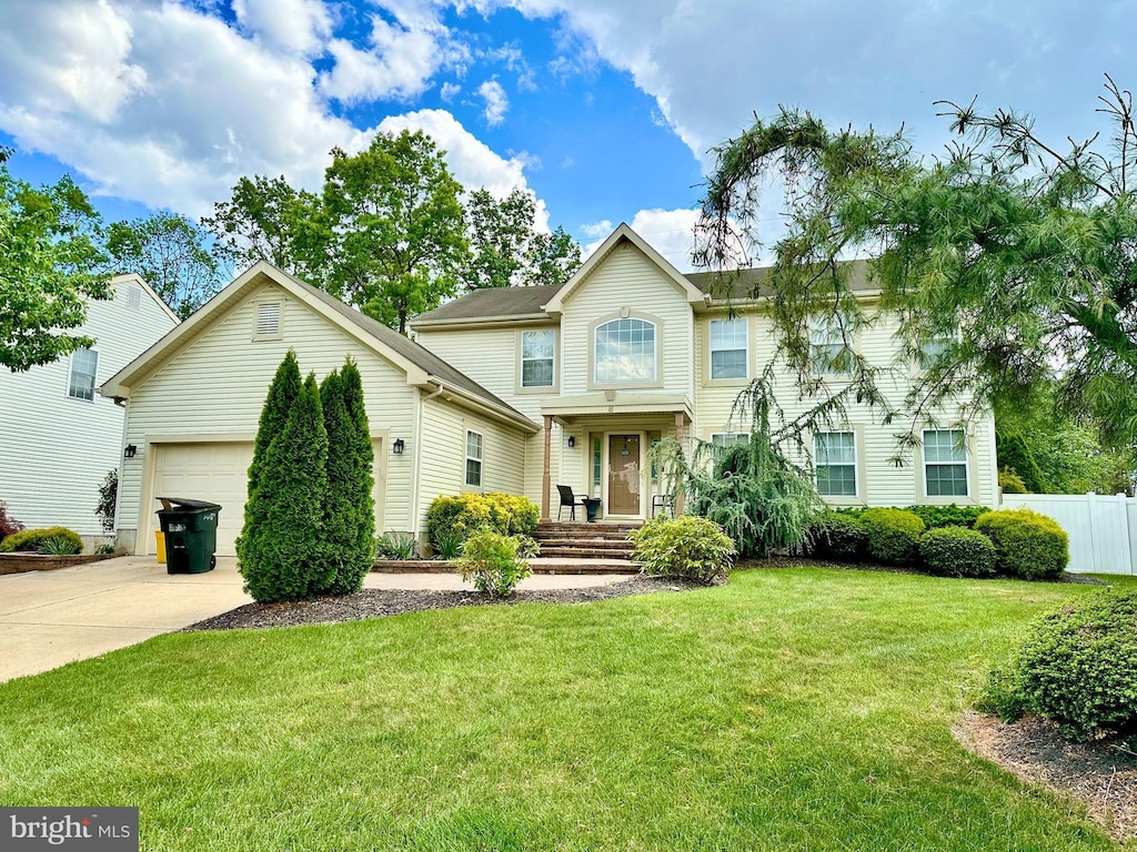 view of front of home featuring an attached garage and concrete driveway
