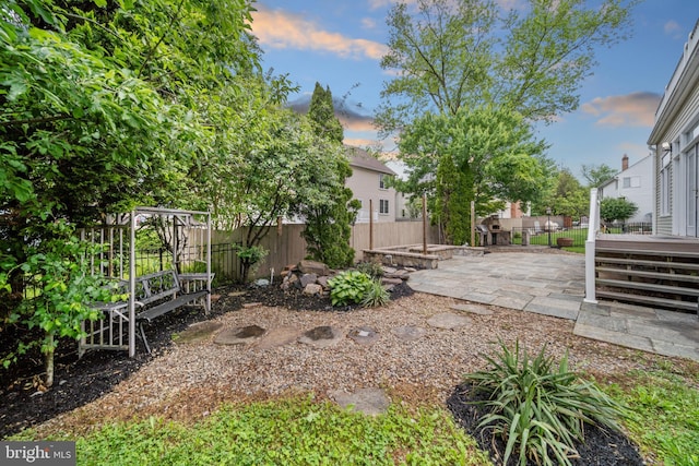 2054 Madrillon Rd, Vienna, VA 22182 - yard at dusk featuring a patio