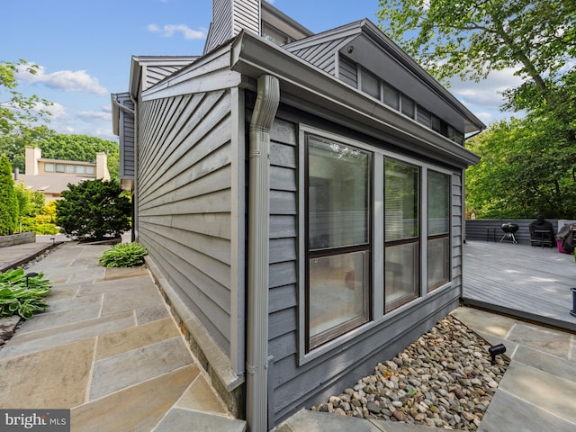 11041 Solaridge Dr, Reston, VA 20191 - view of property exterior with a wooden deck and a chimney