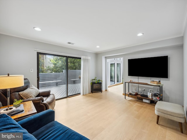 11041 Solaridge Dr, Reston, VA 20191 - living room with wood finished floors, ornamental molding, and recessed lighting