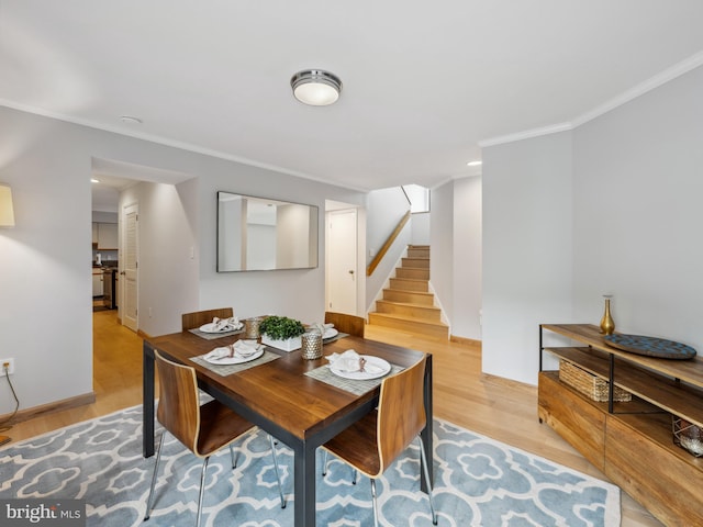 11041 Solaridge Dr, Reston, VA 20191 - dining space featuring stairway, ornamental molding, light wood finished floors, and baseboards