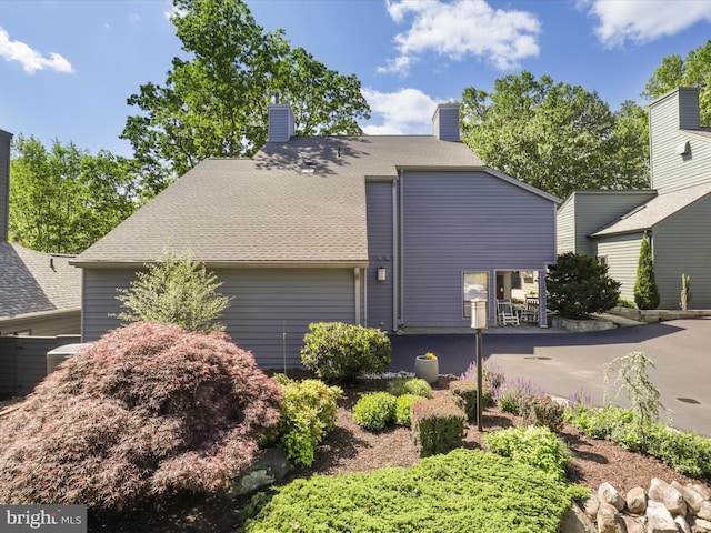 11041 Solaridge Dr, Reston, VA 20191 - view of property exterior featuring a shingled roof