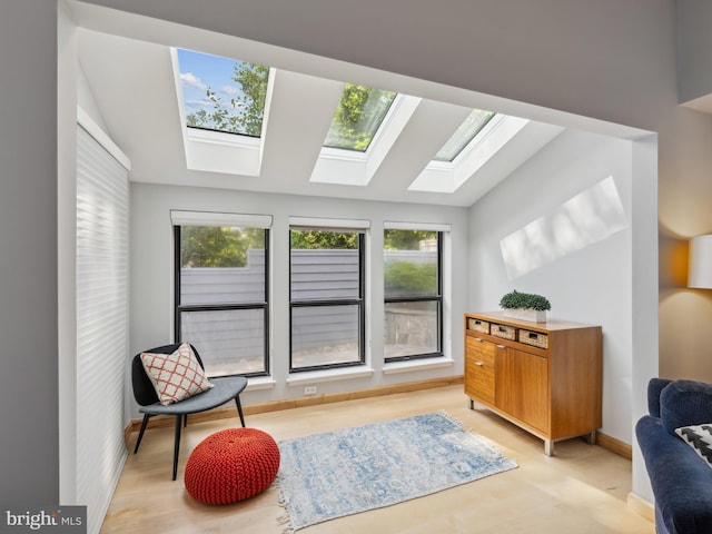 11041 Solaridge Dr, Reston, VA 20191 - sitting room with a skylight, vaulted ceiling, and light wood-type flooring