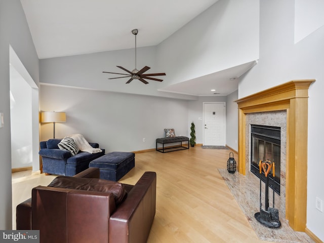 11041 Solaridge Dr, Reston, VA 20191 - living area featuring wood finished floors, a fireplace, a ceiling fan, baseboards, and high vaulted ceiling