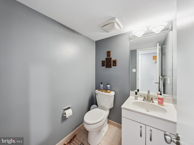 11041 Solaridge Dr, Reston, VA 20191 - bathroom with toilet, vanity, tile patterned floors, and baseboards