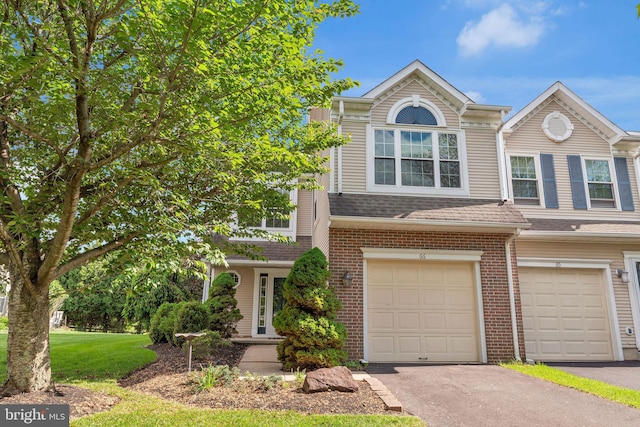 66 Cypress Pl, Newtown, PA 18940 - multi unit property with driveway, a garage, brick siding, and a front lawn