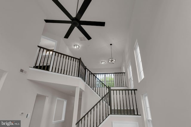 66 Cypress Pl, Newtown, PA 18940 - stairs with high vaulted ceiling, ceiling fan, and a chandelier