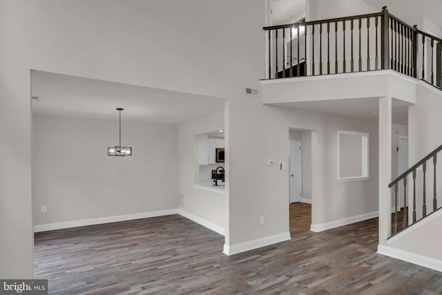66 Cypress Pl, Newtown, PA 18940 - entryway with wood finished floors, a chandelier, stairway, baseboards, and a high ceiling