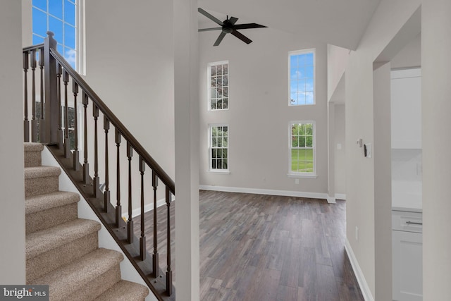 66 Cypress Pl, Newtown, PA 18940 - entrance foyer with high vaulted ceiling, dark wood-type flooring, a ceiling fan, baseboards, and stairs