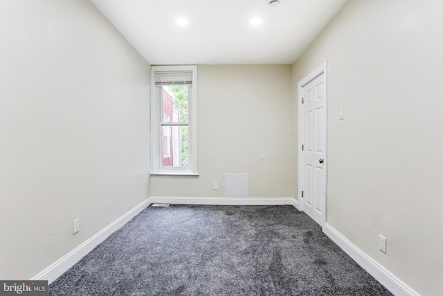 empty room with carpet floors, baseboards, and recessed lighting