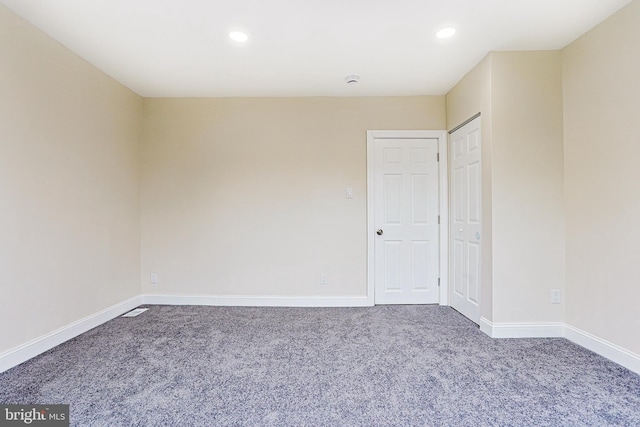 carpeted empty room with recessed lighting and baseboards